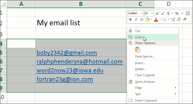 Shows an Excel window open with four email addresses highlighted and the user copying them via a popup menu.